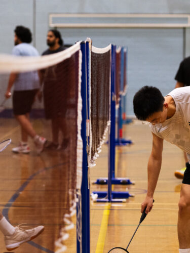 _B7A6494 badminton player collecting shuttle